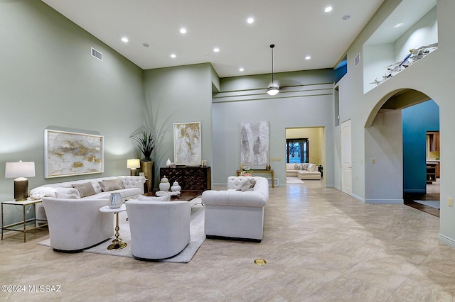 living room with a high ceiling