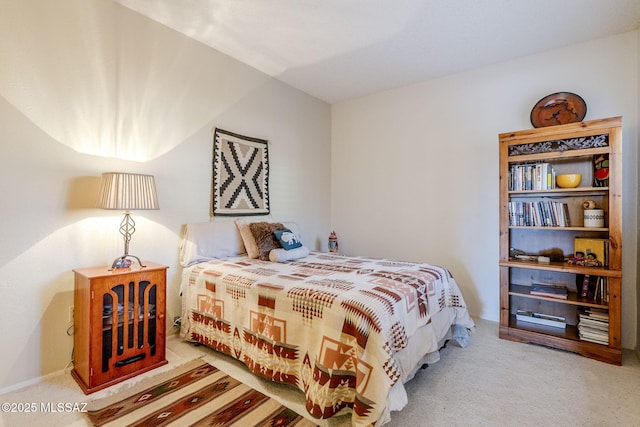 bedroom featuring light carpet