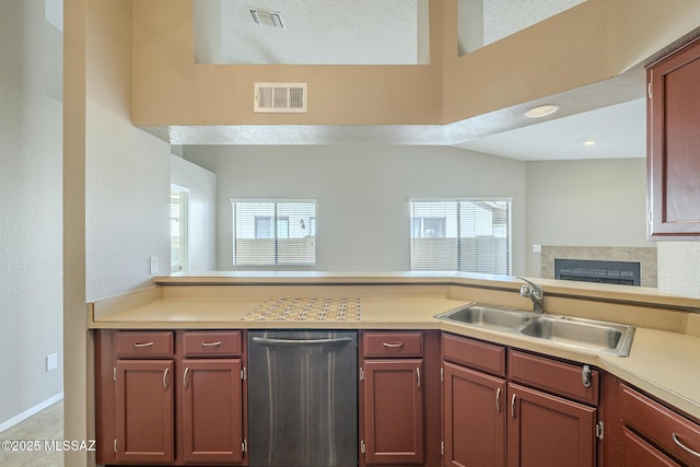 kitchen featuring dishwasher, sink, and plenty of natural light