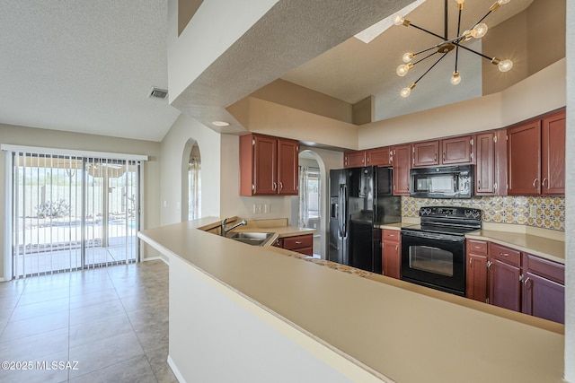 kitchen featuring black appliances, tasteful backsplash, sink, kitchen peninsula, and high vaulted ceiling