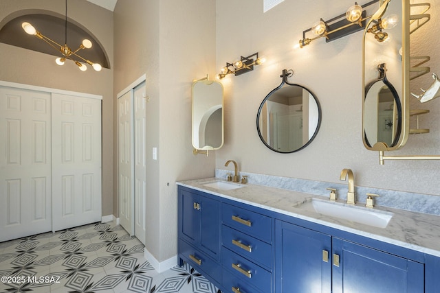 bathroom featuring vanity and an inviting chandelier