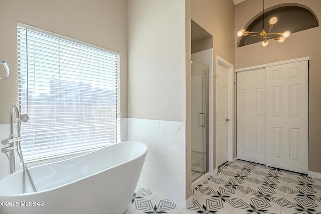 bathroom featuring separate shower and tub and tile patterned floors