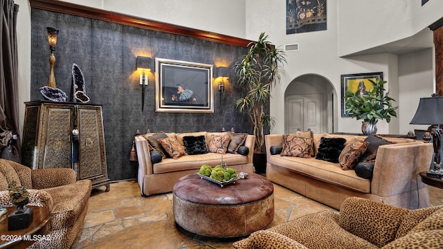 living room featuring a high ceiling