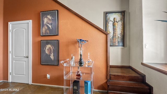 staircase with tile patterned floors