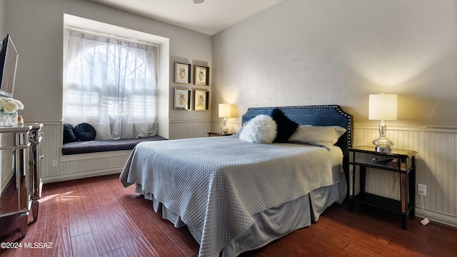 bedroom featuring dark wood-type flooring