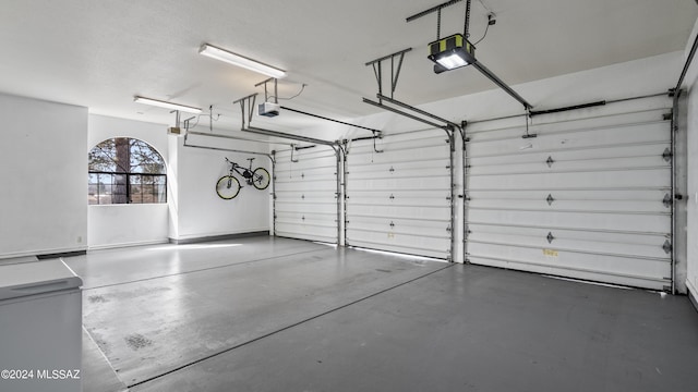 garage featuring a garage door opener