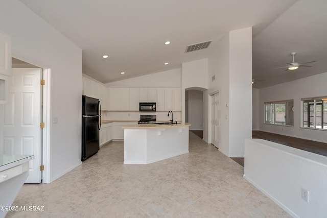 kitchen featuring black appliances, a kitchen island with sink, white cabinets, ceiling fan, and sink