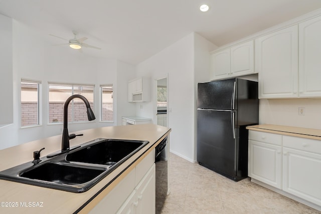 kitchen with black appliances, ceiling fan, white cabinets, light tile patterned flooring, and sink