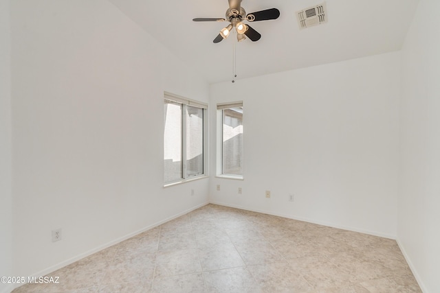 unfurnished room with ceiling fan and high vaulted ceiling