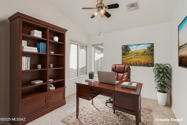 office area featuring ceiling fan, vaulted ceiling, and light carpet