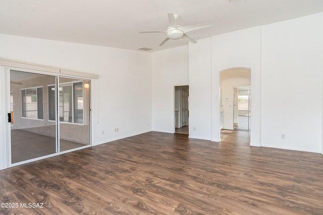 spare room with ceiling fan and dark hardwood / wood-style flooring