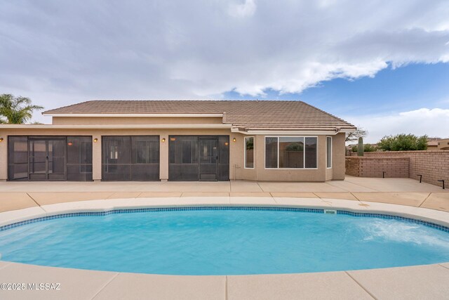 view of swimming pool featuring a patio area