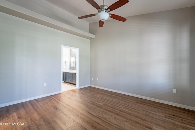 empty room with ceiling fan and light hardwood / wood-style floors