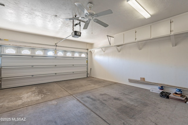 garage with a garage door opener and ceiling fan