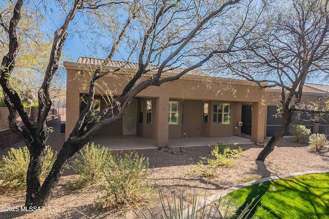 rear view of property with a patio area