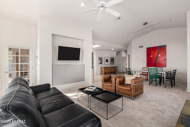 carpeted living room featuring ceiling fan