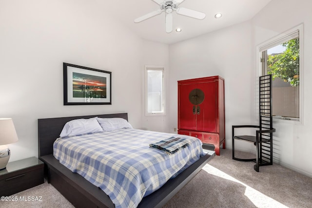 bedroom with ceiling fan and light colored carpet