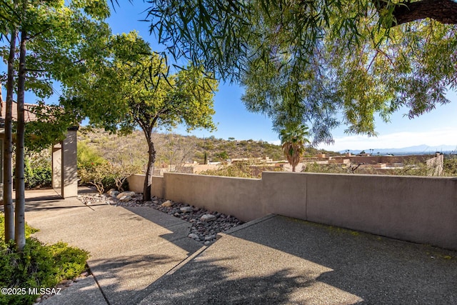 view of patio / terrace featuring a mountain view