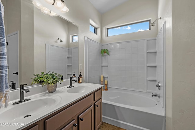 bathroom featuring vanity and  shower combination