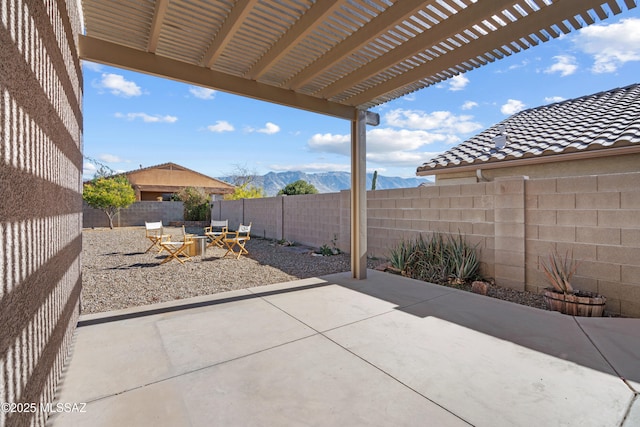 view of patio with a mountain view and a pergola