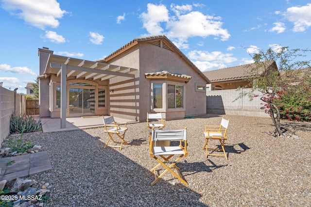 rear view of house featuring a patio