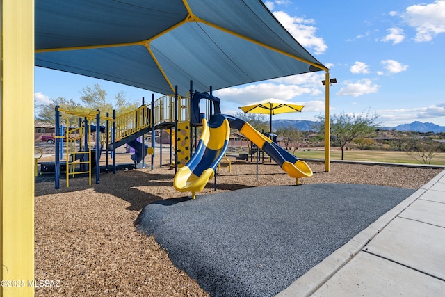 view of playground with a mountain view