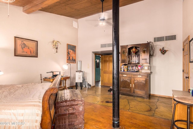 bedroom featuring beam ceiling and wood ceiling