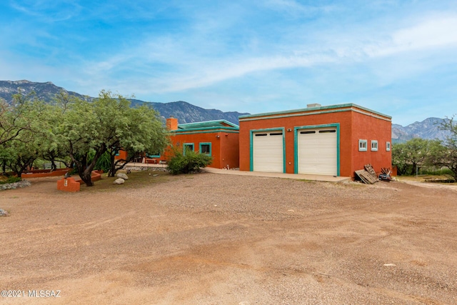 garage featuring a mountain view