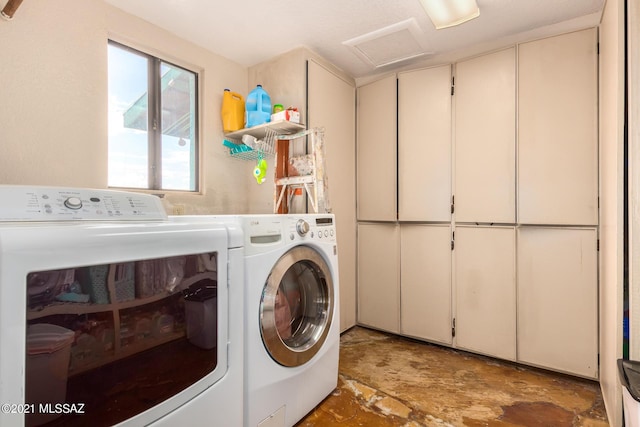 washroom featuring washer and clothes dryer