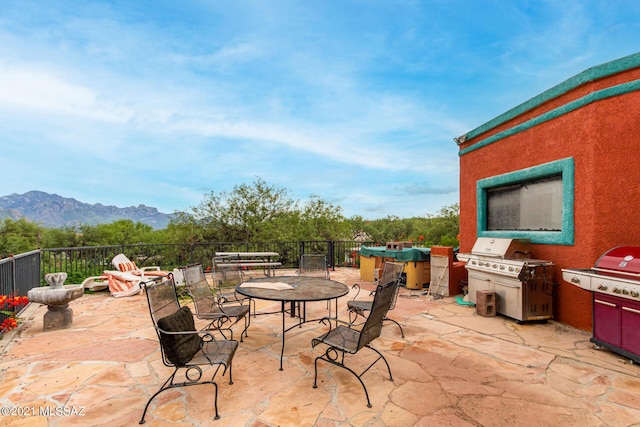 view of patio featuring a mountain view and a grill