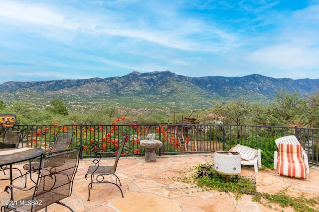 view of patio / terrace featuring a mountain view