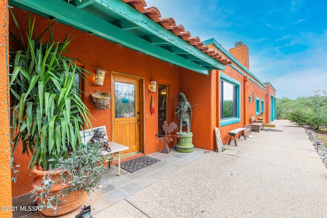 doorway to property featuring a patio