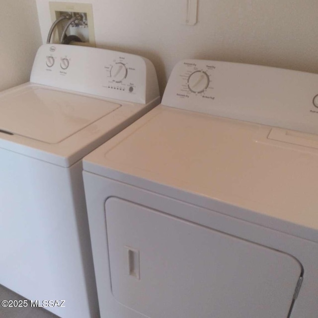 laundry area featuring washing machine and dryer and laundry area