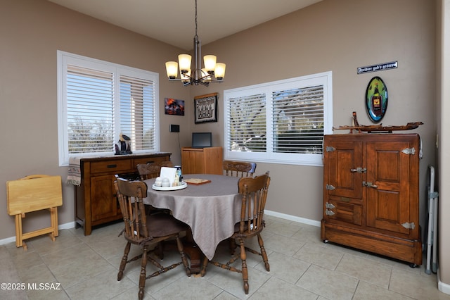 tiled dining space with a notable chandelier