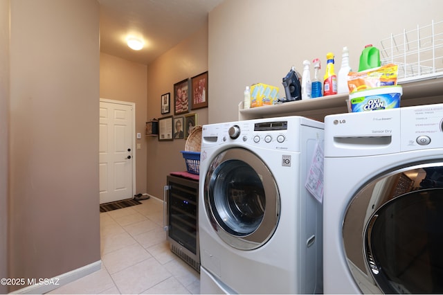 laundry area with wine cooler, light tile patterned floors, and independent washer and dryer