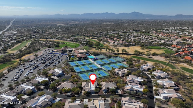 birds eye view of property featuring a mountain view