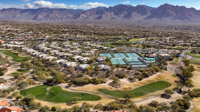 birds eye view of property with a mountain view