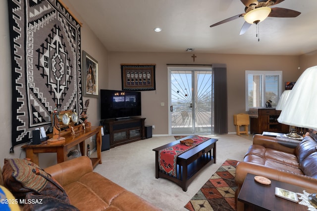 living room with ceiling fan and light colored carpet