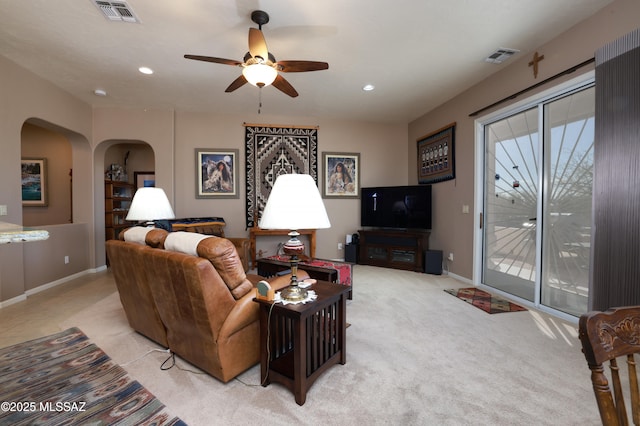 living room featuring ceiling fan and light carpet