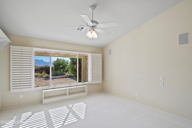 carpeted empty room featuring ceiling fan