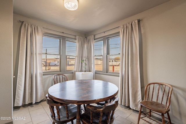 dining area with light tile patterned floors