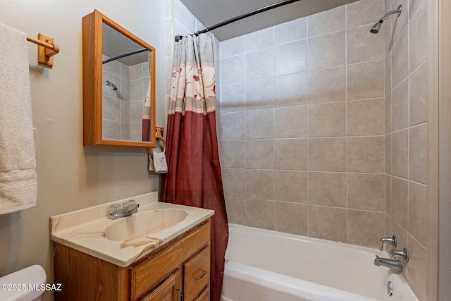 bathroom featuring vanity, shower / bath combination with curtain, and toilet