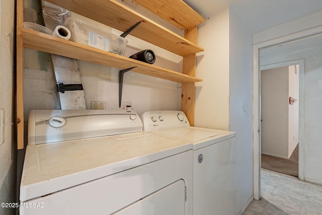 laundry room with laundry area and washing machine and clothes dryer