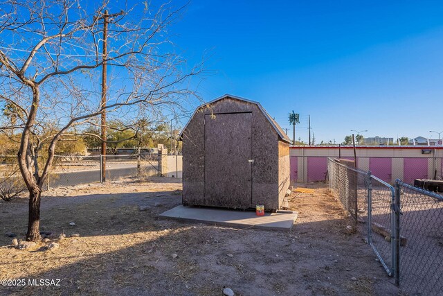 rear view of house featuring an outbuilding