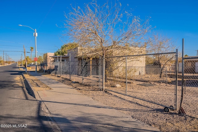 exterior space featuring street lighting and sidewalks