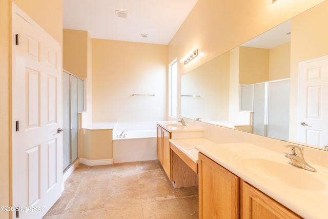 bathroom with separate shower and tub and vanity