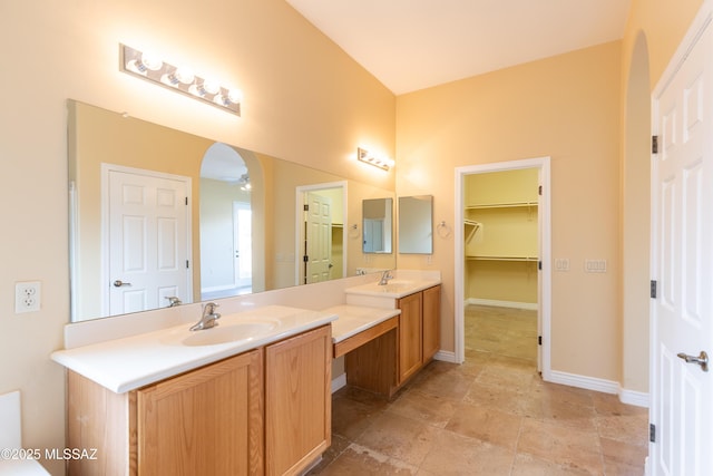 bathroom featuring vanity and ceiling fan