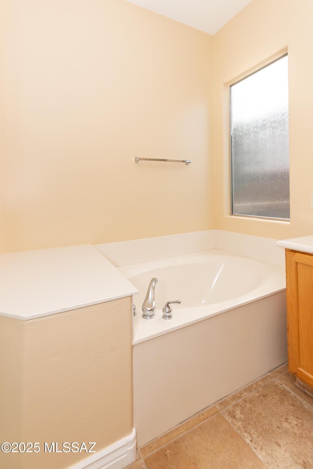 bathroom featuring a bath and vanity