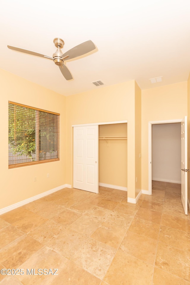 unfurnished bedroom featuring a closet and ceiling fan