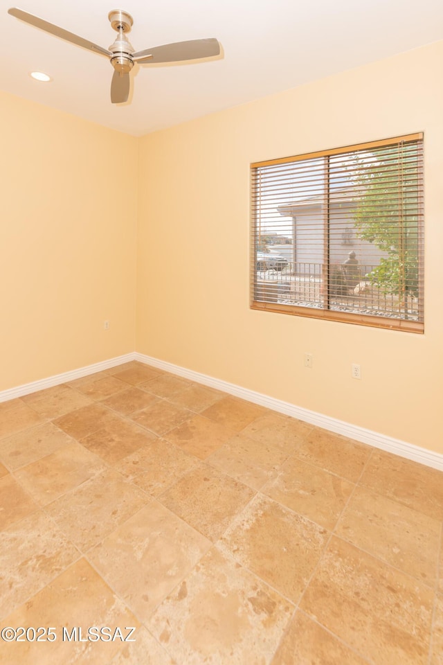 spare room with ceiling fan